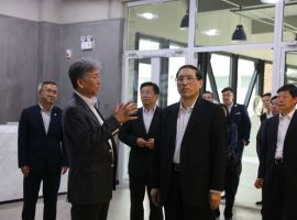 Zhang Yifan, President of Dalian Branch of China Development Bank with Other 6 guests Visited DNUI