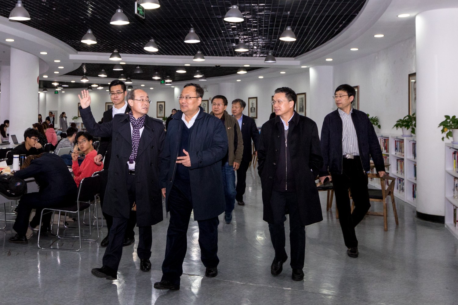 The guests visit the university library.